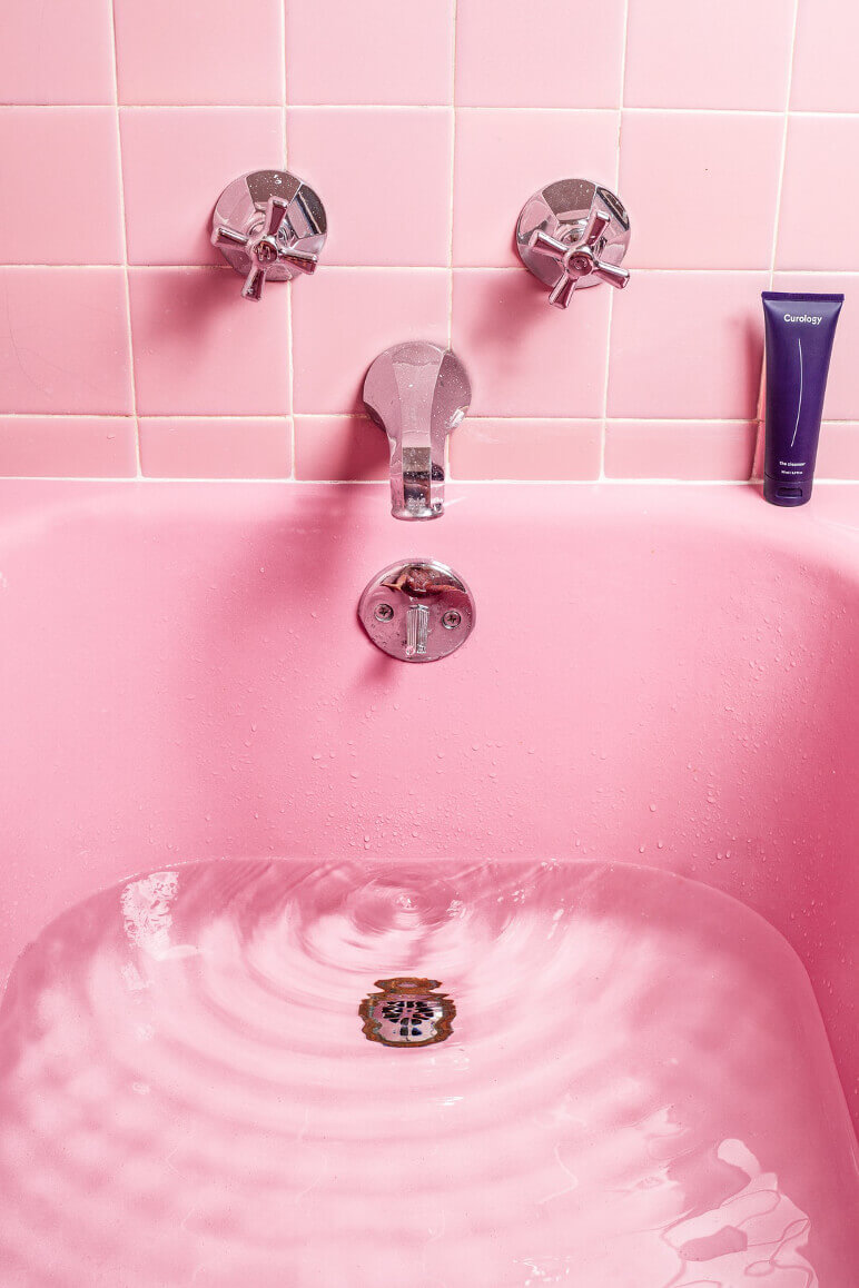 clogged bathroom sink with sitting water