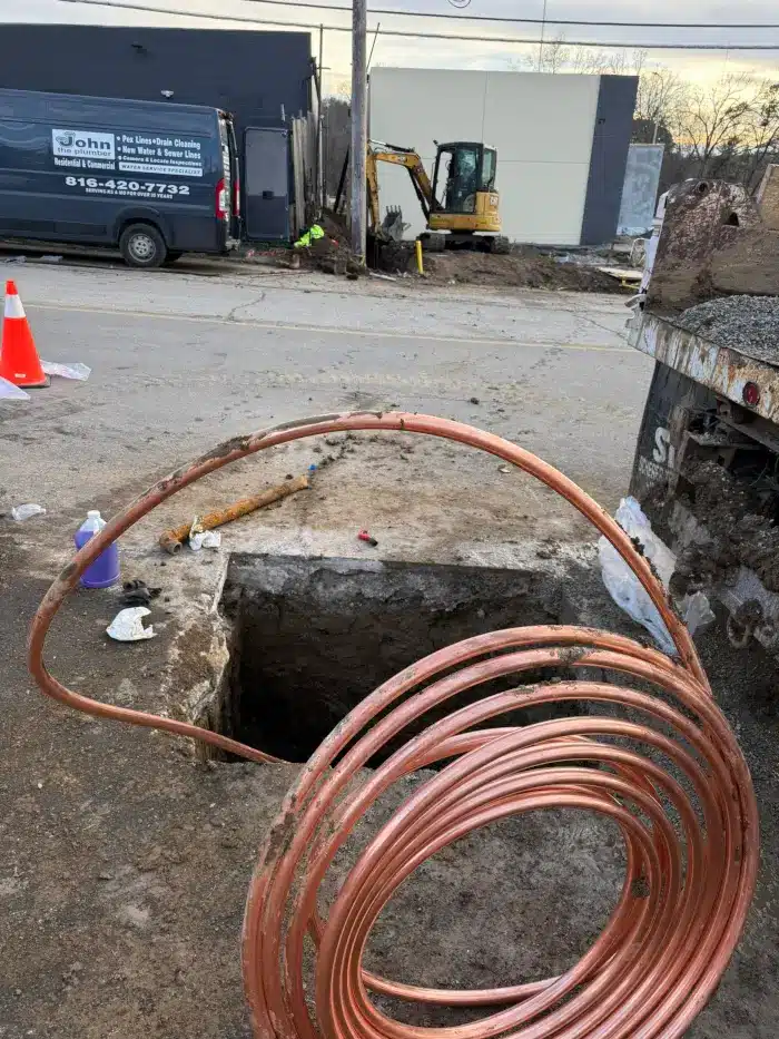 Signs of a Water Line Leak in Kansas City (and What to Do Next) 3 New one-inch copper water service line being pulled into an open trench to replace a failing underground water line at a Kansas City property